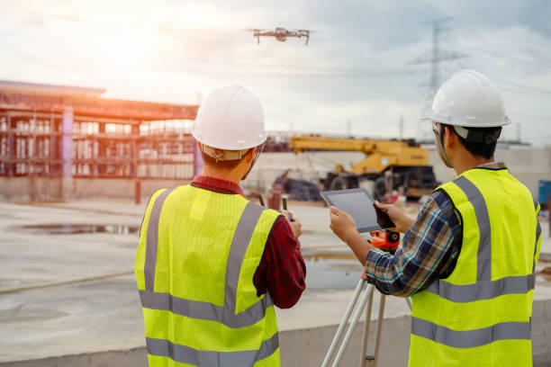 Drone operated by construction worker on building site,flying with drone. Drone operated by construction worker on building site,flying with drone.